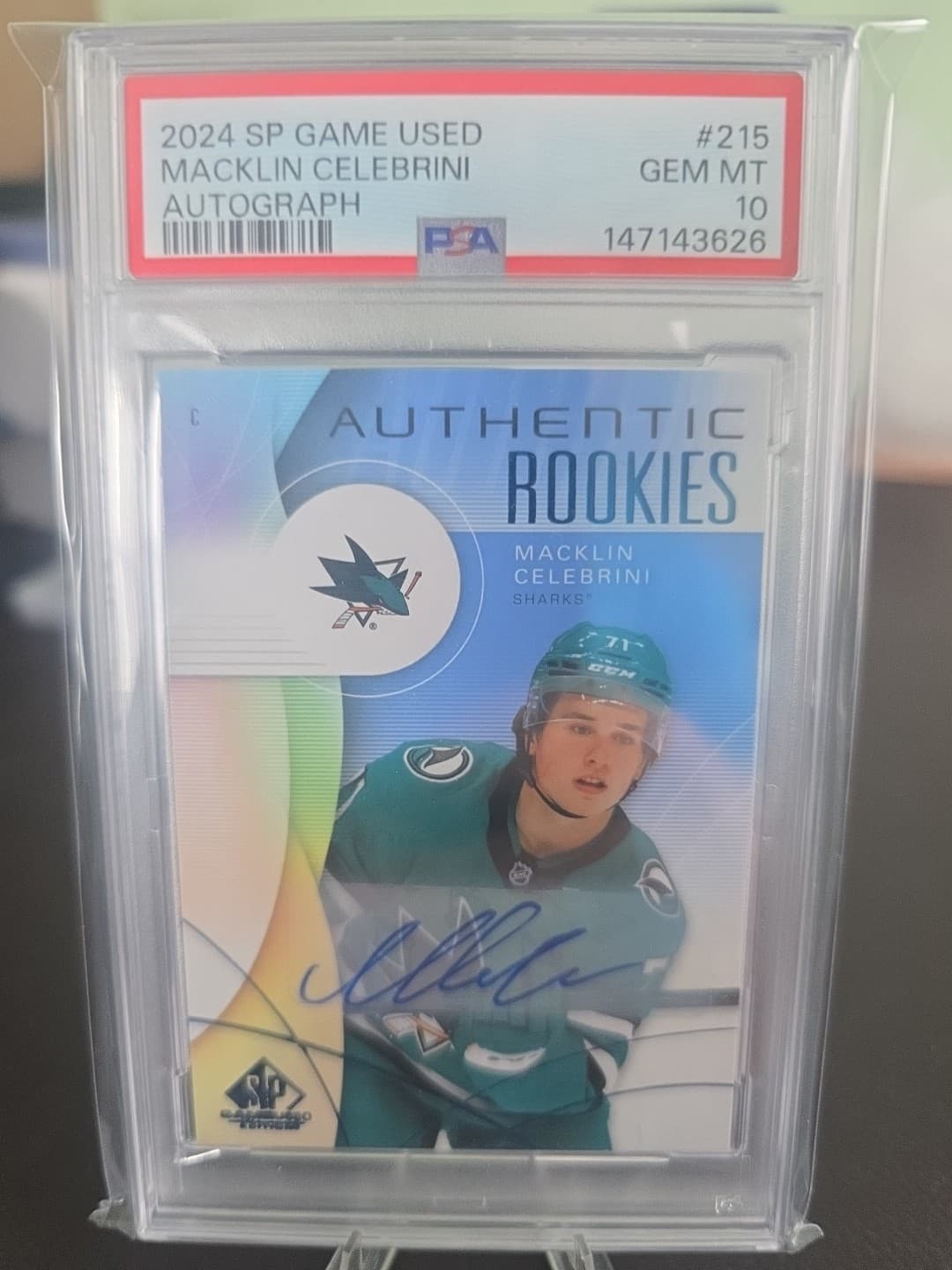 2024-25 UD Sp Game Used Auth Rookies Macklin Celebrini #215 Blue Auto PSA 10