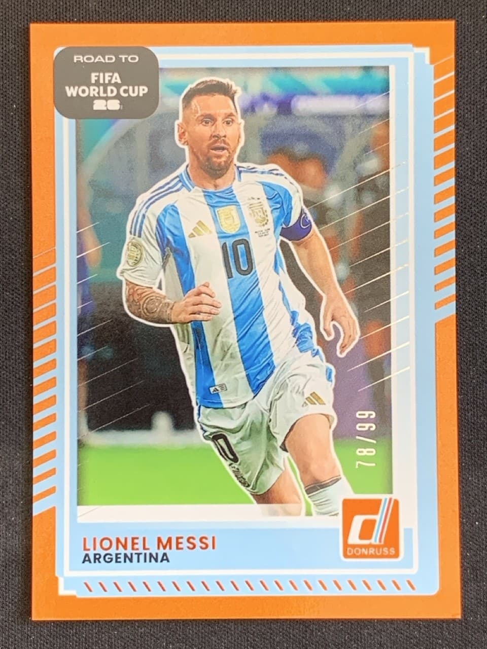 Lionel Messi 2025-26 Panini Donruss Road to FIFA World Cup Orange Base /99 #154