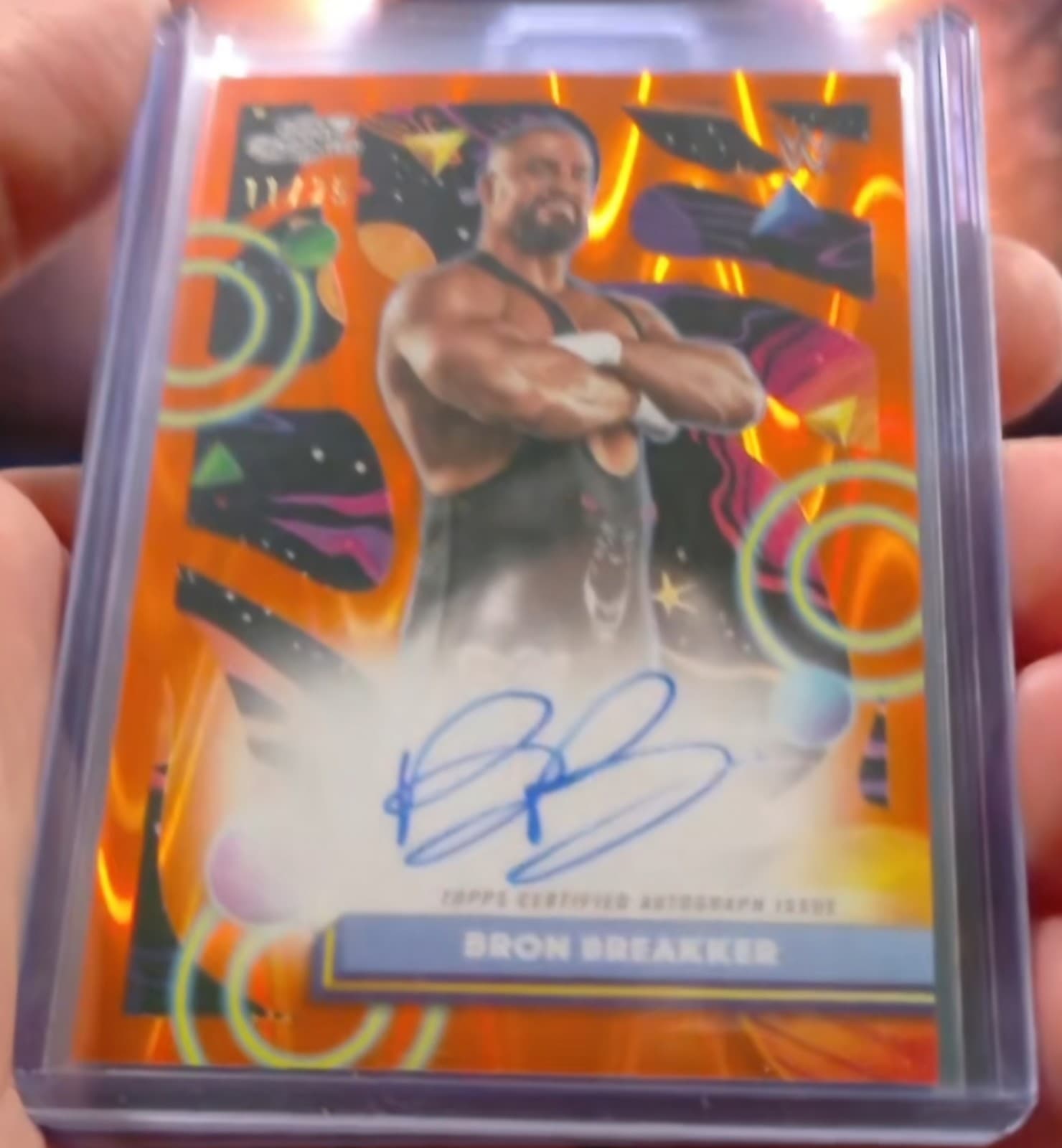 2026 Topps Cosmic Chrome WWE Bron Breakker Orange Refractor Auto /25  